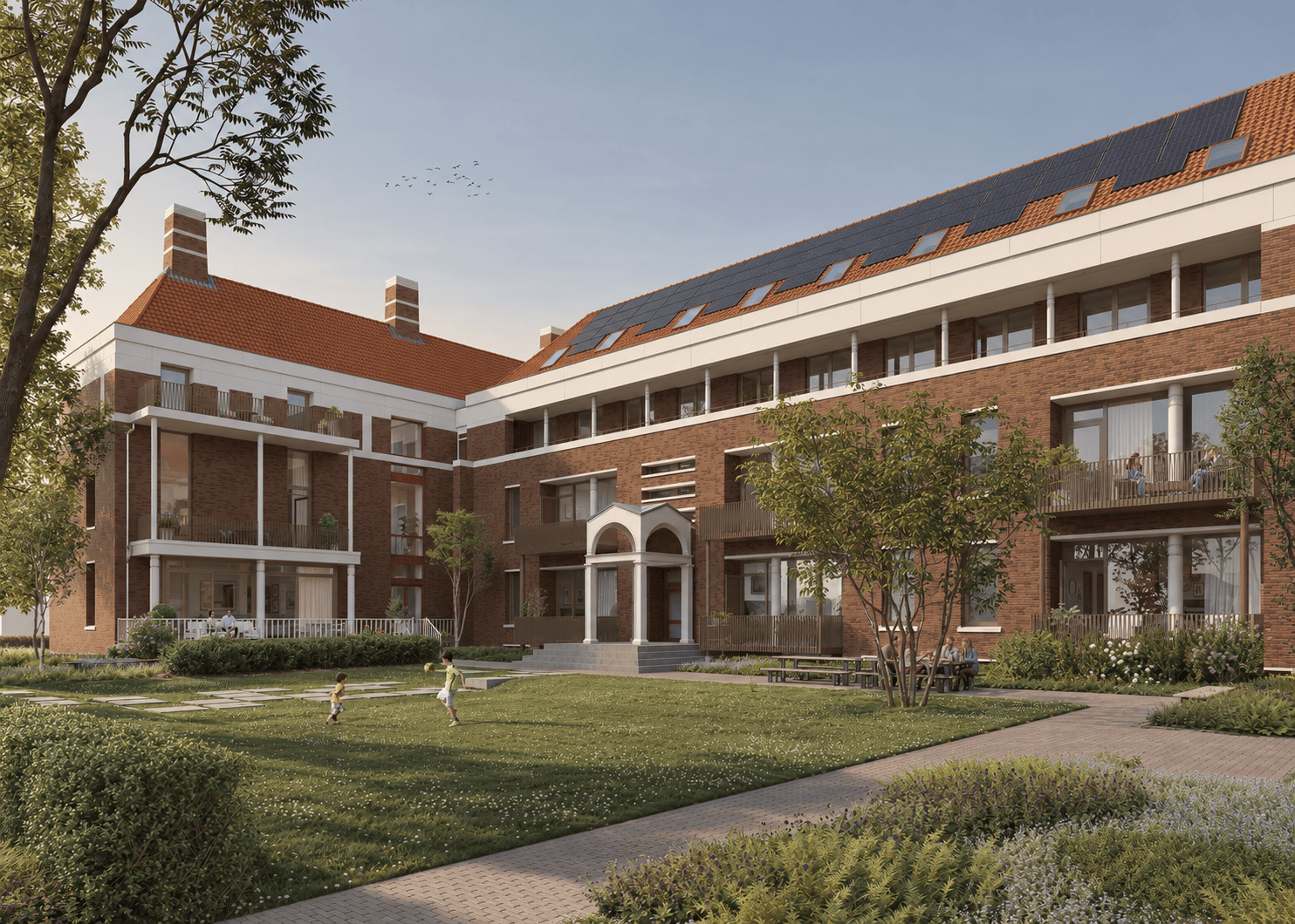 Uitgebreid appartementencomplex met groene tuin en speelruimte, ontworpen door Studio REDD, in een rustige woonwijk.